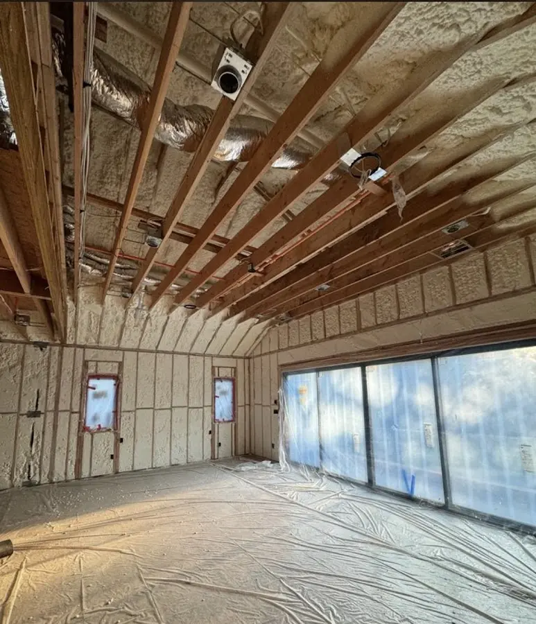 Interior walls and ceiling insulated with spray foam during new construction in Carlstadt